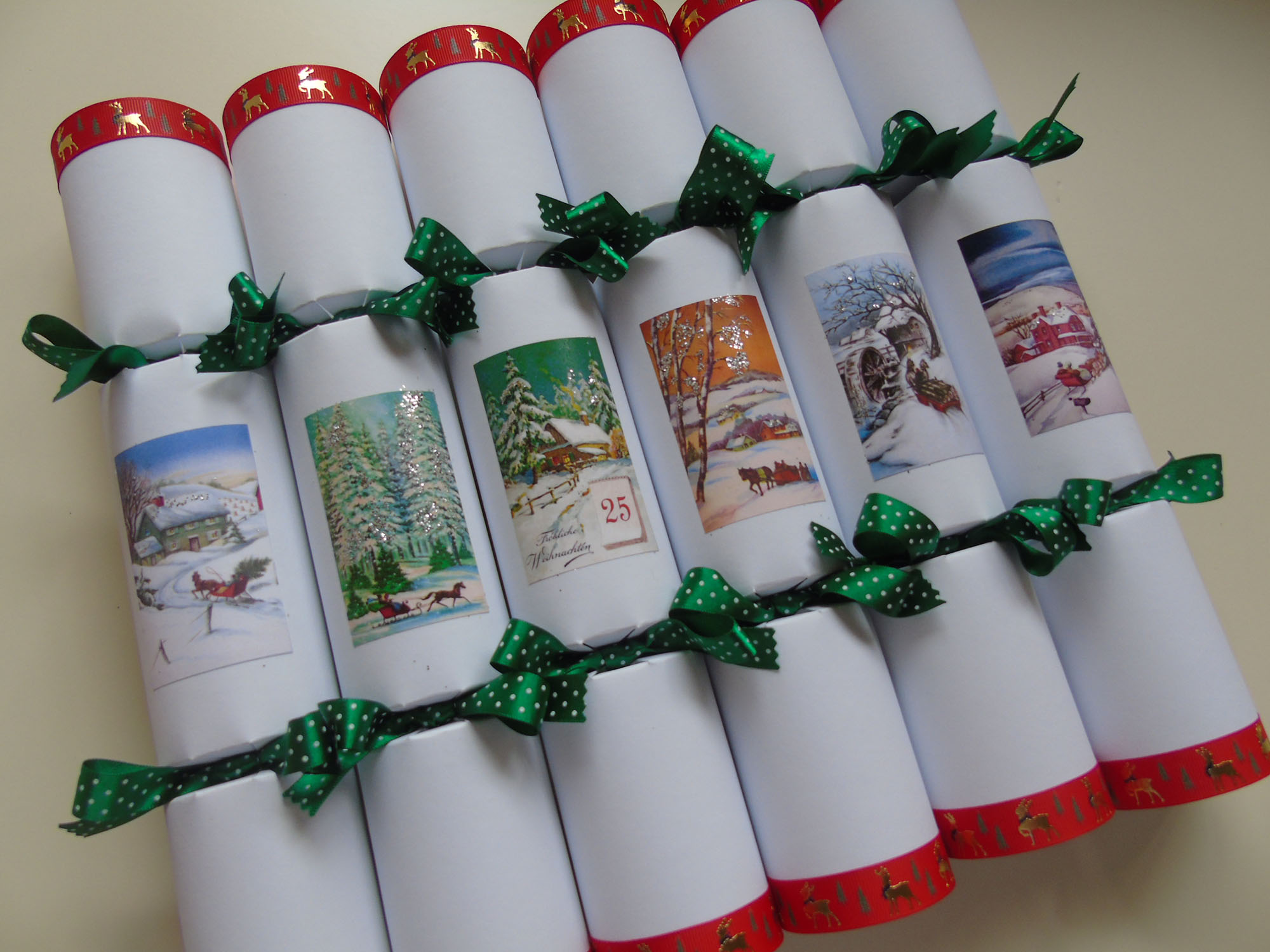 six christmas crackers with midwinter scenes